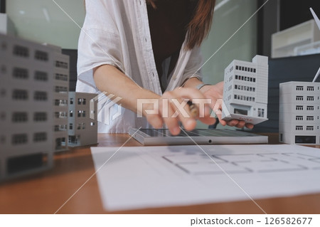 Discussion among businesspeople on the latest developments in solar cell panel technology and Solar Energy Environment city Concept. 126582677