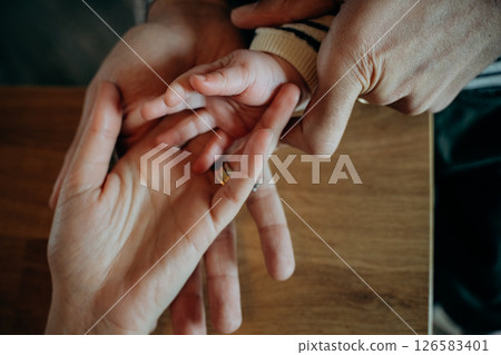 Parent and Child Holding Hands Close-Up 126583401