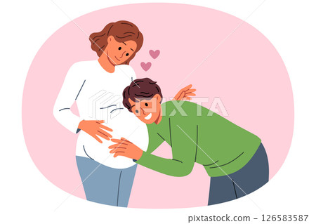 Future dad leans against belly of pregnant woman, listening to movements of baby in womb 126583587