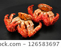 Two Hanasaki crabs with roe are lined up. Both the roe and the crab eggs are included. Black background 126583697