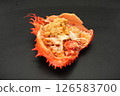 Peeled crab meat served in a Hanasaki crab shell and topped with crab miso 126583700