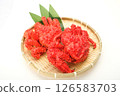 Two bowls of Hanasaki crabs lined up on a colander. White background 126583703