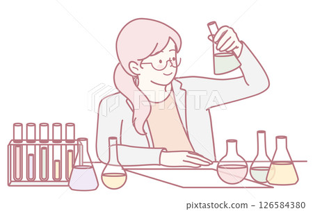 A scientist is conducting various laboratory experiments with different chemicals in a lab 126584380