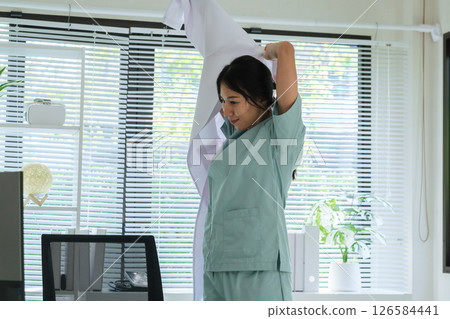 doctor preparing in uniform for daily routine at clinic before starting healthcare duties in hospital doctor preparing in uniform for daily routine at clinic before starting healthcare duties in hospital 126584441