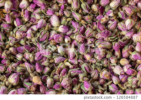 Floral background of small dried purple rose buds. Floral background of small dried purple rose buds. 126584887