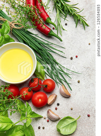 Fresh herbs and spices with olive oil creating culinary inspiration 126584893