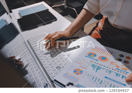 Expert woman asian female people review data number costing managerial account prepare monthly actual cost variance report at tax audit office. ESG sheet budget control ERP process service project. 126584937