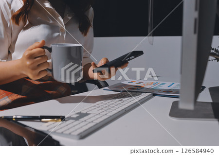 Expert woman asian female people review data number costing managerial account prepare monthly actual cost variance report at tax audit office. ESG sheet budget control ERP process service project. 126584940