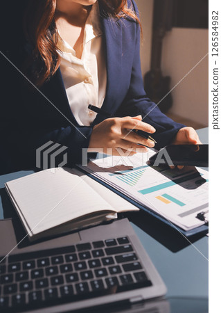 Expert woman asian female people review data number costing managerial account prepare monthly actual cost variance report at tax audit office. ESG sheet budget control ERP process service project. Expert woman asian female people review data number costing managerial account prepare monthly actual cost variance report at tax audit office. ESG sheet budget control ERP process service project. 126584982