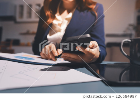 Expert woman asian female people review data number costing managerial account prepare monthly actual cost variance report at tax audit office. ESG sheet budget control ERP process service project. Expert woman asian female people review data number costing managerial account prepare monthly actual cost variance report at tax audit office. ESG sheet budget control ERP process service project. 126584987