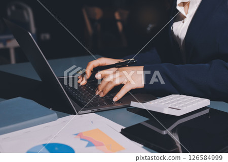 Expert woman asian female people review data number costing managerial account prepare monthly actual cost variance report at tax audit office. ESG sheet budget control ERP process service project. 126584999