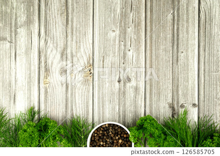 Herbs and black pepper on table. View from above. Dill, parsley and peppercorns. Recipe for cooking 126585705