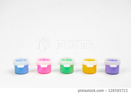 Plastic jars with paints for drawing. School props for creativity Plastic jars with paints for drawing. School props for creativity 126585721