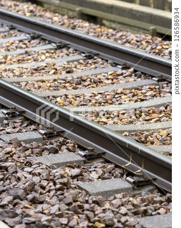 Rain-soaked railway tracks 126586934