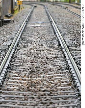 Rain-soaked railway tracks Rain-soaked railway tracks 126586935
