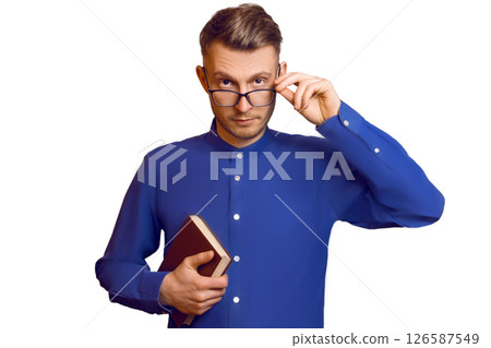 young botanist in a point and with a book in his hands 126587549