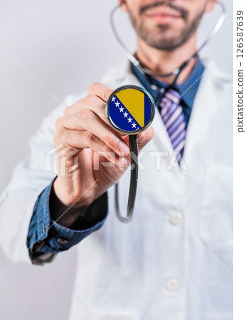 Bosnia health and medical insurance concept. Bosnia healthcare system, doctor holding stethoscope 126587639