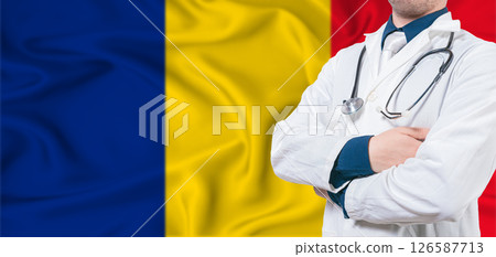 Romania healthcare concept. Male doctor on Romanian flag. Doctor with crossed arms on Romanian flag 126587713