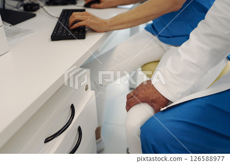 Inappropriate behavior of doctor, holding nurse by thigh. Workplace harassment. Inappropriate behavior of doctor, holding nurse by thigh. Workplace harassment. 126588977