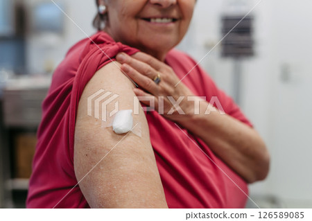 Close up of elderly patient after vaccination. 126589085