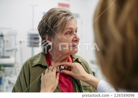 Elderly patient having heart checked by geriatric doctor 126589096