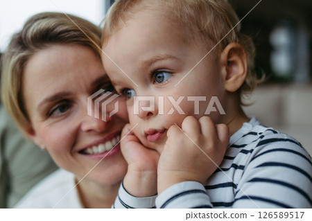 Beautiful mother spendig time with little son, 126589517
