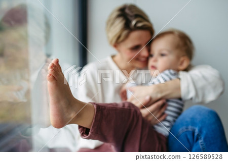 Beautiful mother hugging little son, 126589528
