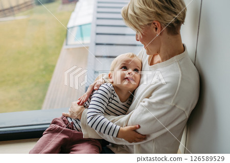 Beautiful mother hugging little son, 126589529