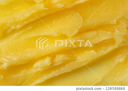 Abstract yellow sugar body exfoliating scrub texture. Mango scrub for body or face pilling. Skin care body scrub background. Abstract yellow sugar body exfoliating scrub texture. Mango scrub for body or face pilling. Skin care body scrub background. 126589868