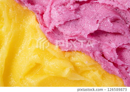 Raspberry and melon fruit scrub texture. Bright pink and yellow creamy smear with exfoliating crystals. Organic cosmetic body care peeling. Natural skincare exfoliating scrubber treatment. 126589873