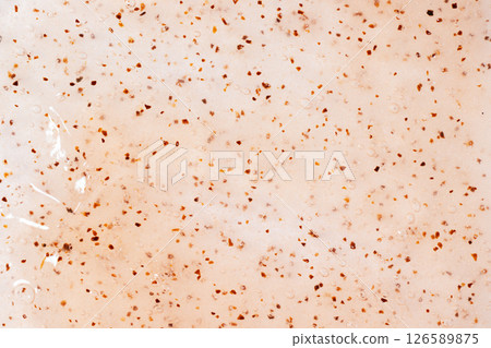 Apricot scrub texture close up. Bright orange smear with exfoliating particles. Natural beauty exfoliating scrubber background. Skincare sugar peeling. 126589875
