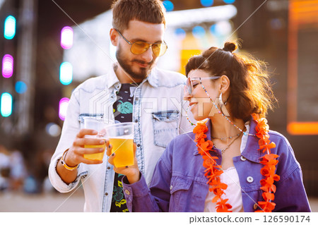 Group of friends with beer dancing and having fun at music festival together. Summer Beach party. Group of friends with beer dancing and having fun at music festival together. Summer Beach party. 126590174