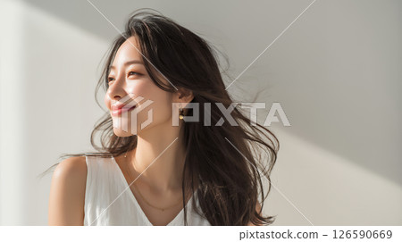 Asian woman with beautiful flowing hair Asian woman with beautiful flowing hair 126590669