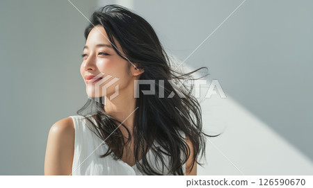 Asian woman with beautiful flowing hair Asian woman with beautiful flowing hair 126590670