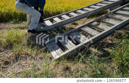 Unloading the combine from the truck Unloading the combine from the truck 126590877