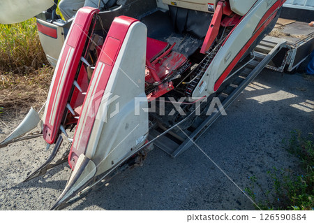Unloading the combine from the truck 126590884