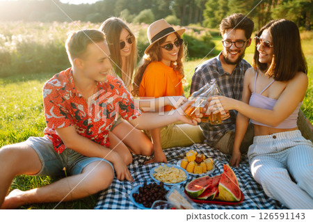 Happy groop of friend resting in nature in picnic. People, lifestyle, relaxation, vacations concept. 126591143