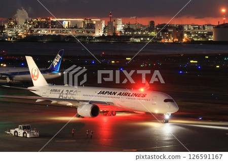 Haneda Airport at night: Passenger plane heading for a night flight 126591167