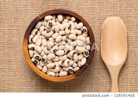 Black-eyed pea or cowpea in wooden bowl and scoop, Food ingredient, Top view 126591488