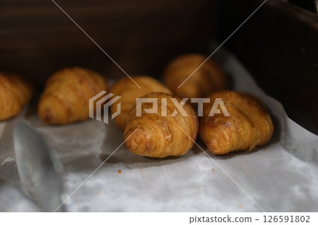 fresh mini croissants, rotation in circle. close up of french croissant, fresh mini croissants, rotation in circle. close up of french croissant, 126591802