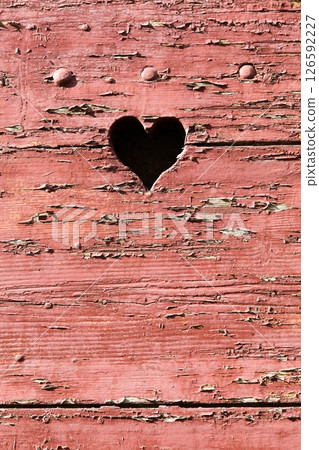 Small heart on a red door in France Small heart on a red door in France 126592227