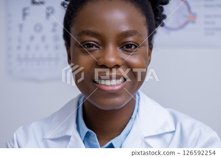 African american female ophthalmologist working at her office 126592254