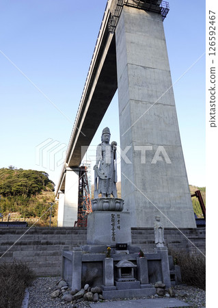 A memorial monument stands next to the new concrete Amarube Bridge. A memorial monument stands next to the new concrete Amarube Bridge. 126592467