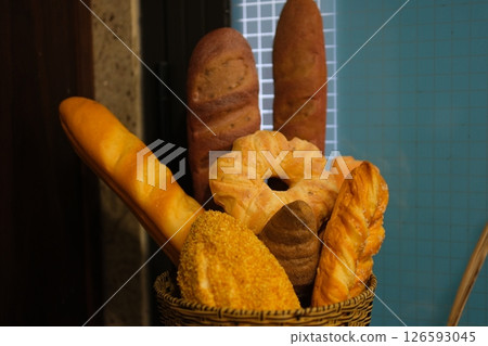 Assortment of Freshly Baked Breads and Rolls in Basket Assortment of Freshly Baked Breads and Rolls in Basket 126593045