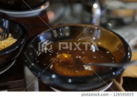 fish sauce with garlic chili pepper fish sauce Sweet and Sour Chili garlic dipping fish Sauce bowl isolated on white background, top view. pickle carrot and radish Vietnamese fish sauce 126593055