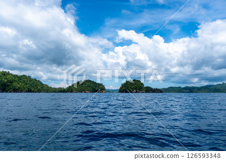 Rocky islets under blue sky, Togian Islands, Sulawesi, Indonesia 126593348