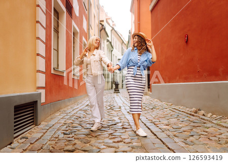 Two beautiful women having fun outdoors. Fun, weekend concept. Active lifestyle. 126593419