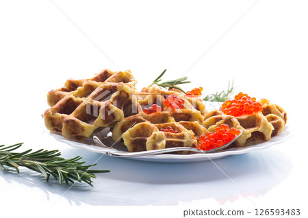 Delicious potato waffles with red caviar on a white background 126593483