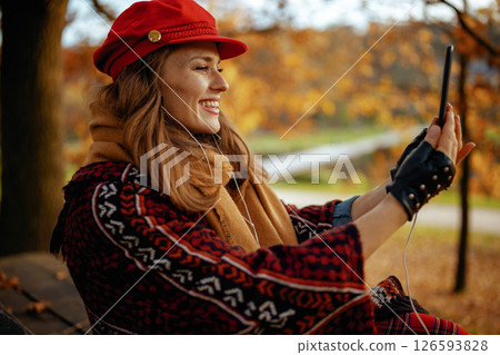 woman using phone and having video conference woman using phone and having video conference 126593828