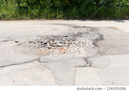 Asphalt road surface crack or damage. Asphalt road surface crack or damage. 126595086